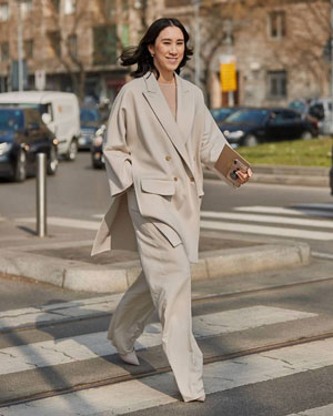 Asian businesswoman wearing cool toned beige suit