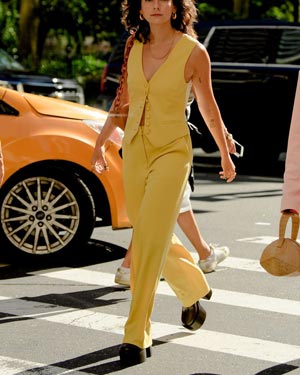 yellow vest suit styled with platforms