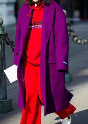 coat trends 2022 bright purple coat matched with red tracksuit and sneakers
