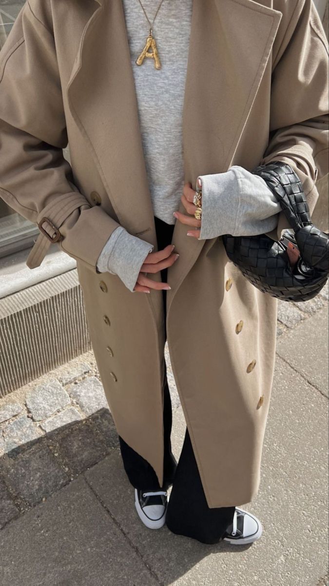 woman wearing long camel wool coat