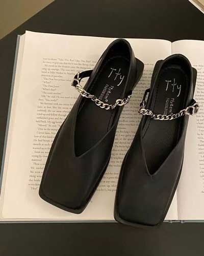 square toed black v-shaped loafer with jewellered chain