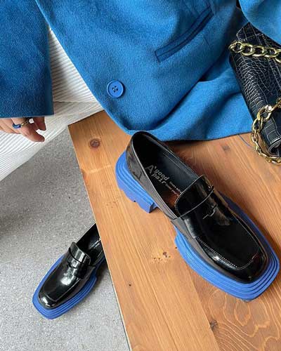 flat shoe trends summer 2022 - statement blue sole square toed loafer