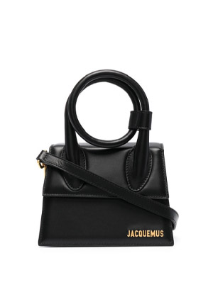 small black trapeze leather bag with rounded adjustable top handle by French designer, Jacquemus